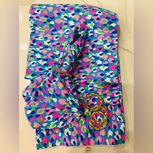 Lilly Pulitzer cloth dinner napkins and gold faux bamboo napkin rings.